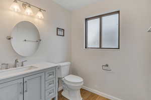 Bathroom featuring vanity and light wood-style flooring