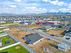 Aerial perspective of suburban area featuring a mountainous background