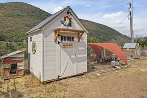 View of poultry coop with a mountain view