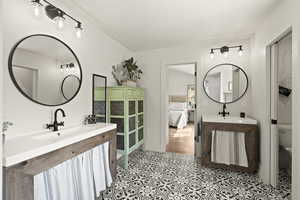 Ensuite bathroom featuring two vanities