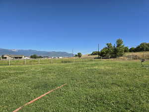 View of yard featuring a view of countryside and a mountain view