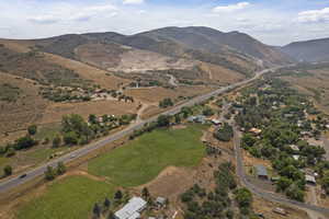 View of property location with a mountain backdrop and rural landscape