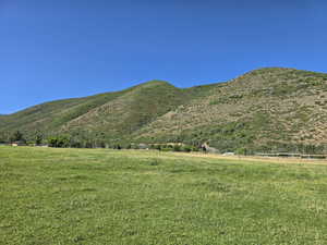View of mountain backdrop featuring rural landscape