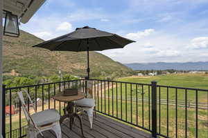 Balcony featuring a mountain view and a rural view