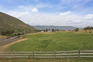 View of mountain background featuring rural landscape and agricultural land
