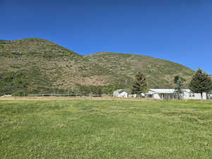 View of mountain background featuring rural landscape