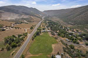 Aerial view of property's location with a mountain backdrop