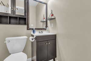 Bathroom featuring vanity and toilet