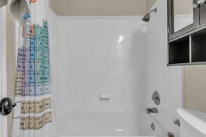 Full bath featuring shower / bath combo