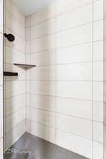 Bathroom with tiled shower