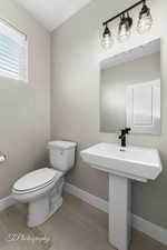 Bathroom with baseboards and light wood-style floors
