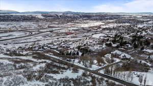 Snowy aerial view featuring a mountain view