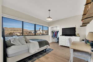 Bedroom featuring great natural light and grand a stately view.