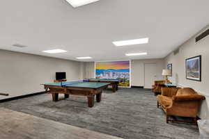 Playroom featuring billiards table and ping pong.