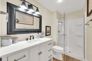 Bathroom featuring vanity, a shower.