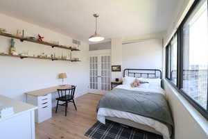 Bedroom featuring French doors