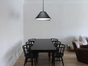 Dining area with light wood floors and crown molding