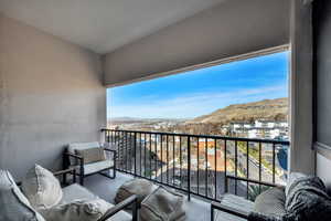 Balcony with a mountain and valley view.