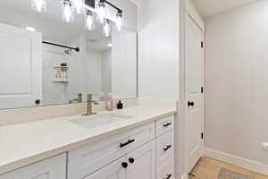 Bathroom features large vanity and quartz countertops