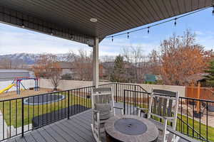 Amazing yard! In ground trampoline, swingset area, putting green, covered deck, patio and more!