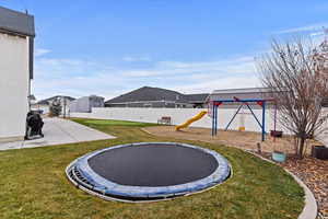 Fence backyard with a trampoline