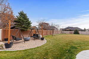 Amazing yard! In ground trampoline, swingset area, putting green, covered deck, patio and more!