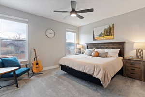 Primary suite with double vanity, quartz tops, deep soaker tub, separate shower with quartz surround, and a walk-in closet