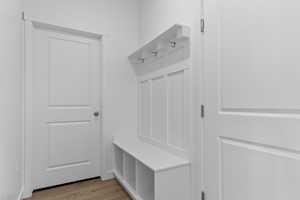 Mudroom with light wood finished floors