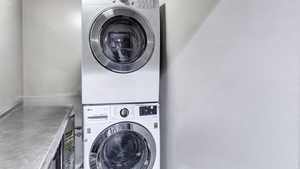 Laundry area with stacked washing machine and dryer