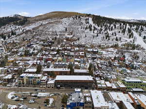 Snowy aerial view with a mountain view