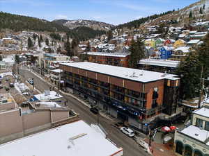 Snowy aerial view with a mountain view