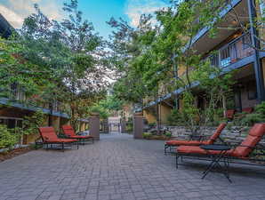 View of community with a patio area and a gate