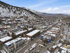 Snowy aerial view featuring a mountain view