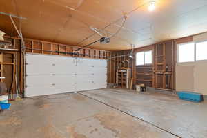 Garage featuring a garage door opener