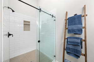 Full bathroom featuring a stall shower