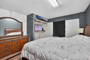 Bedroom featuring a textured ceiling