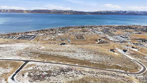 Aerial view of property's location featuring a water and mountain view