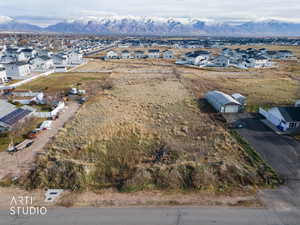 Aerial perspective of suburban area featuring a mountain backdrop