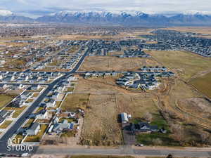 View of property location featuring a mountain backdrop and nearby suburban area
