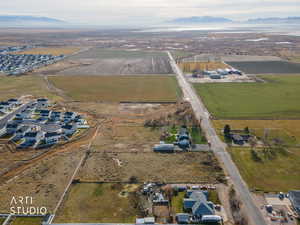 View of property location with rural landscape, large plots for crops, and mountains