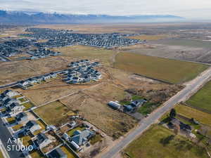 Aerial overview of property's location featuring rural landscape and nearby suburban area