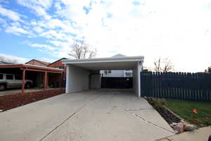 Carport area that could easily be enclosed to become a garage