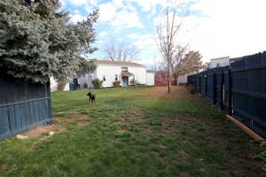 View of fenced backyard