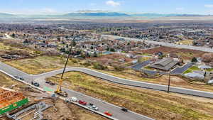 Aerial view of residential area featuring a mountain backdrop