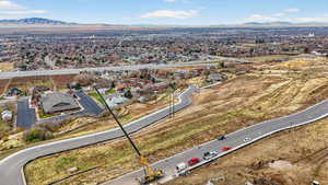 Aerial perspective of suburban area with a mountainous background