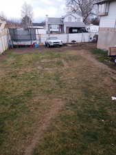 View of yard with a trampoline