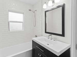 Full bathroom with vanity and bathtub / shower combination