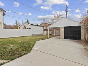Garage featuring a detached garage