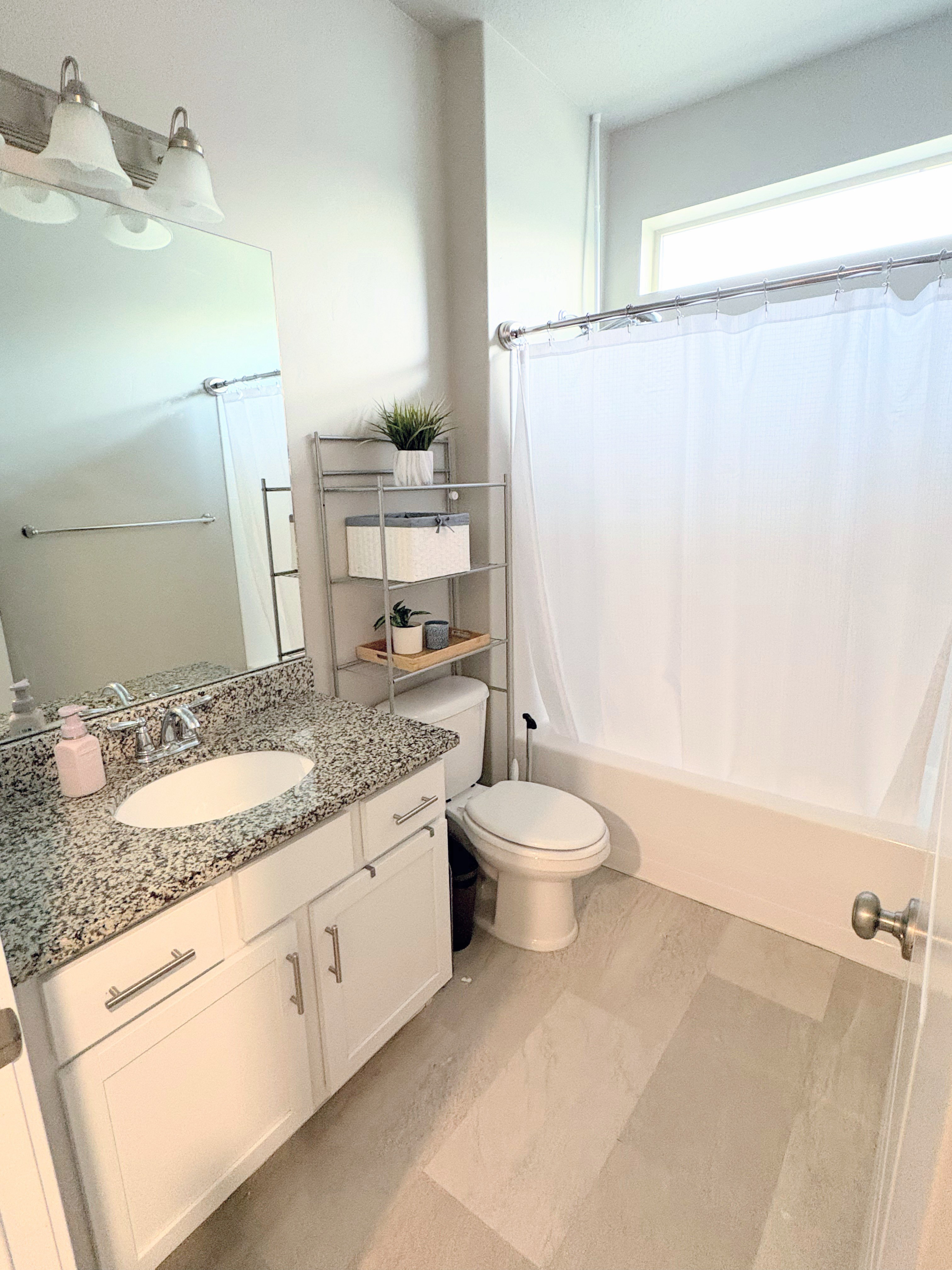 Full bath with vanity and shower / bath combo