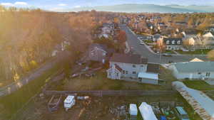 Aerial perspective of suburban area featuring a mountainous background